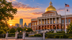 Massachusetts State House Stun Gun Laws and Licensing | Nittany Self Defense Massachusetts State House in Boston with its golden dome illuminated by warm sunset light